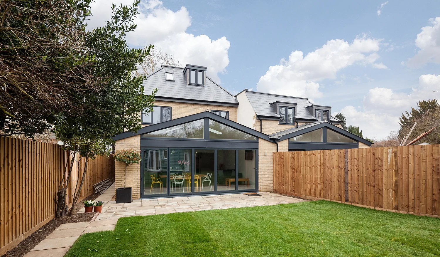 Sunroom Home Additions Attached To The Fenced In Backyard