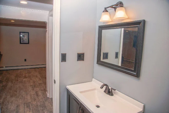 Vanity lighting in a bathroom with neutral color walls
